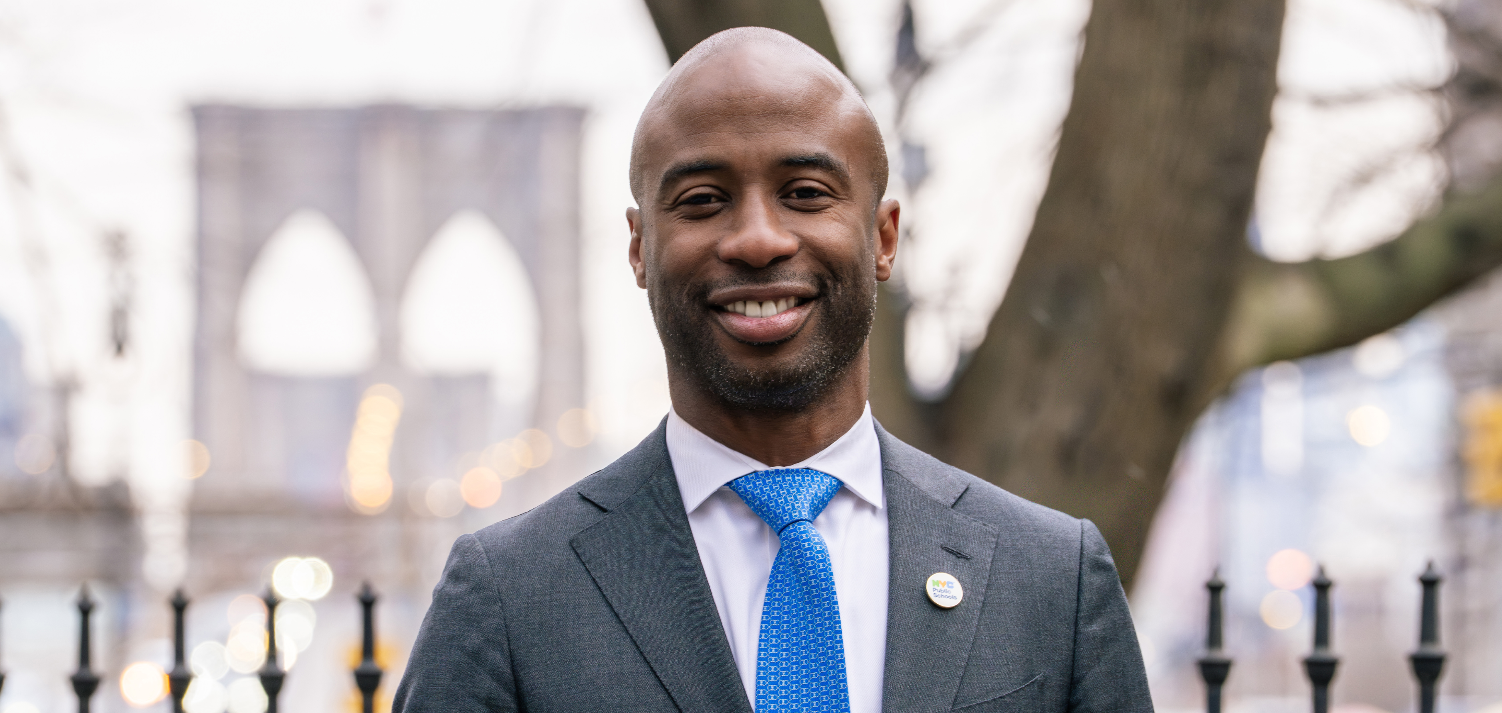 Photo of Chancellor Kamar H. Samuels standing in front of stairs.