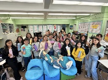 Students show off their reusable water bottles for Climate Action Day.