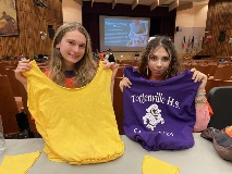 Students convert tshirts into tote bags.