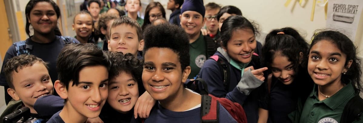 A diverse group of children together in a playground