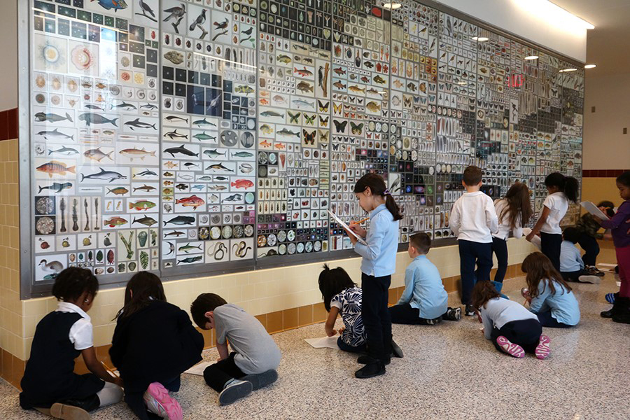 Children studying the artwork Cabinet by Penelope Umbrico