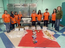 Students and teachers organize garbage.