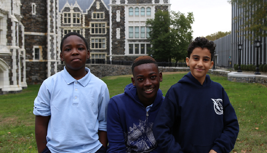 Three students visiting a college campus