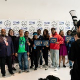 Student filmmakers pose with other attendees.