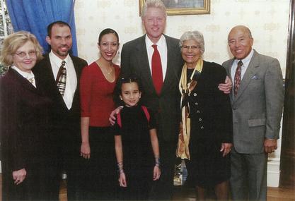 Dr Trias Receiving Presidential Honor Dr. Helen Rodriguez-Trias (center, right) standing with President Bill Clinton (center) and her family after receiving the Presidential Citizens Medal in January 2001