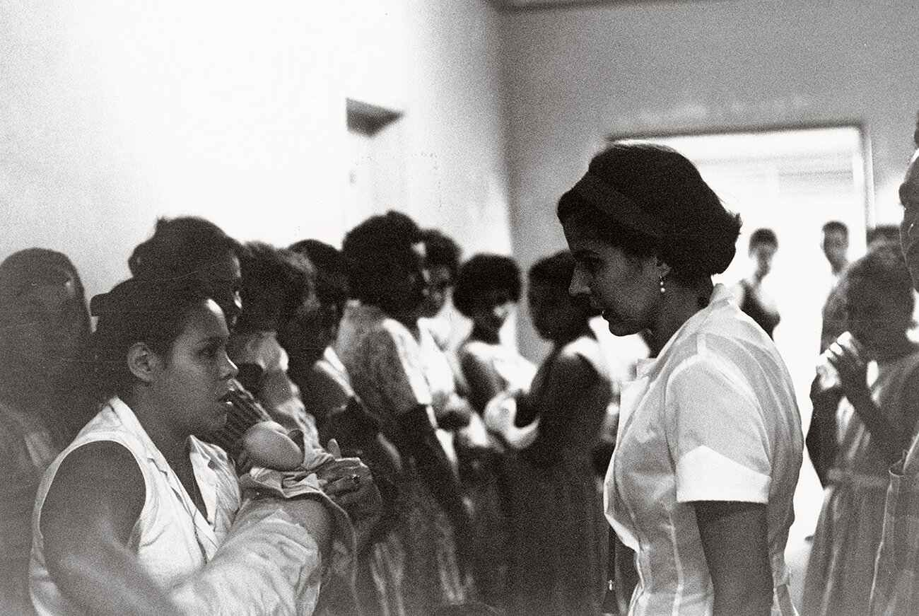 Dr. Trias Talking with Patient Dr. Helen Rodriguez-Trias speaking with new mothers at a hospital