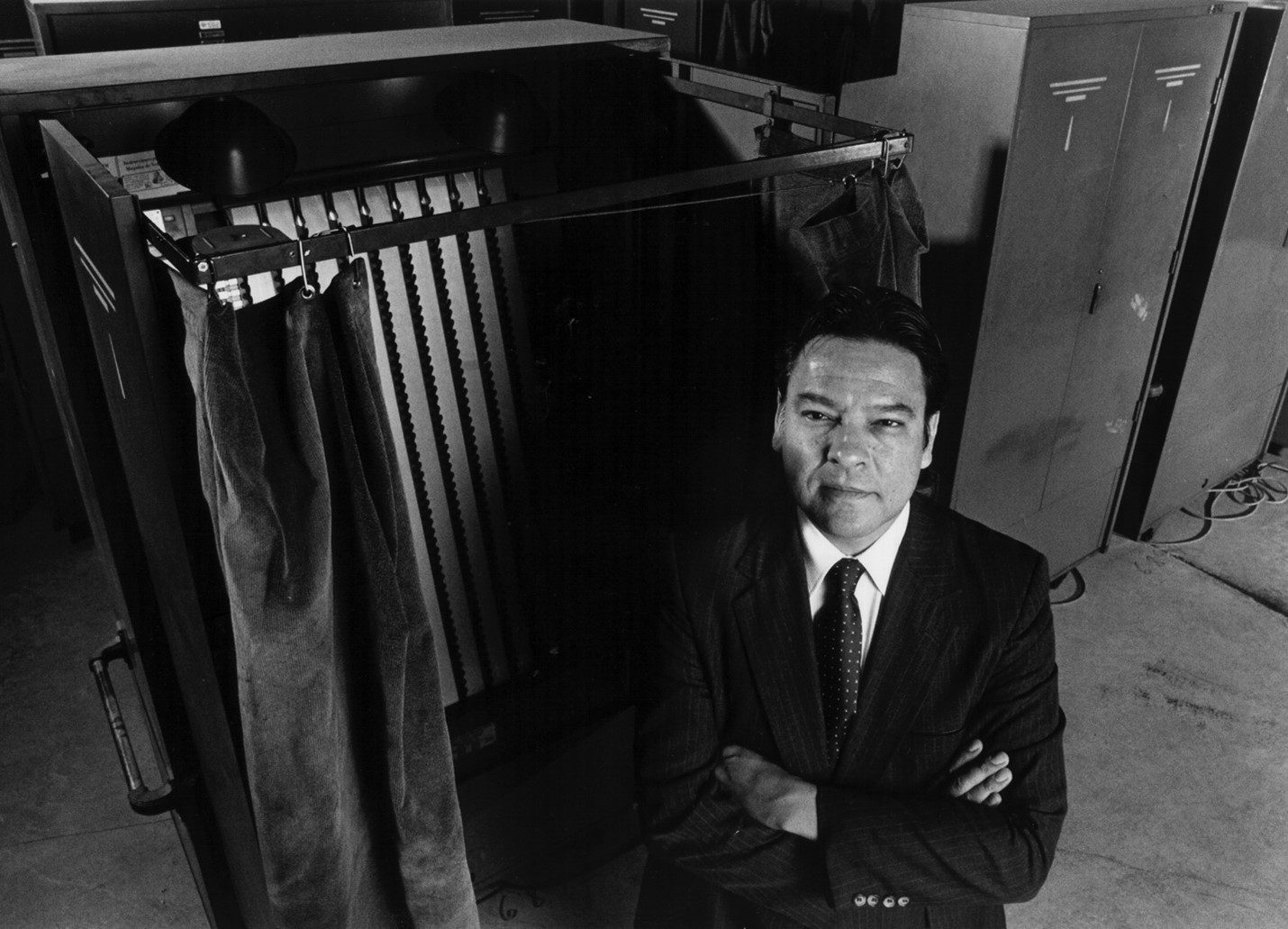Willie Velásquez Helped Double the Number of Latino Elected Officials in Just Over a Decade Top-down view of Willie Velásquez as he looks on from a voting booth area