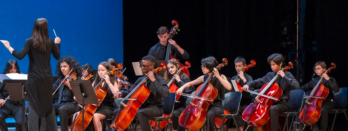 Children's orchestra playing violins
