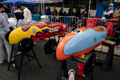 Wide view shot of two soap box cars built by PS 160 students