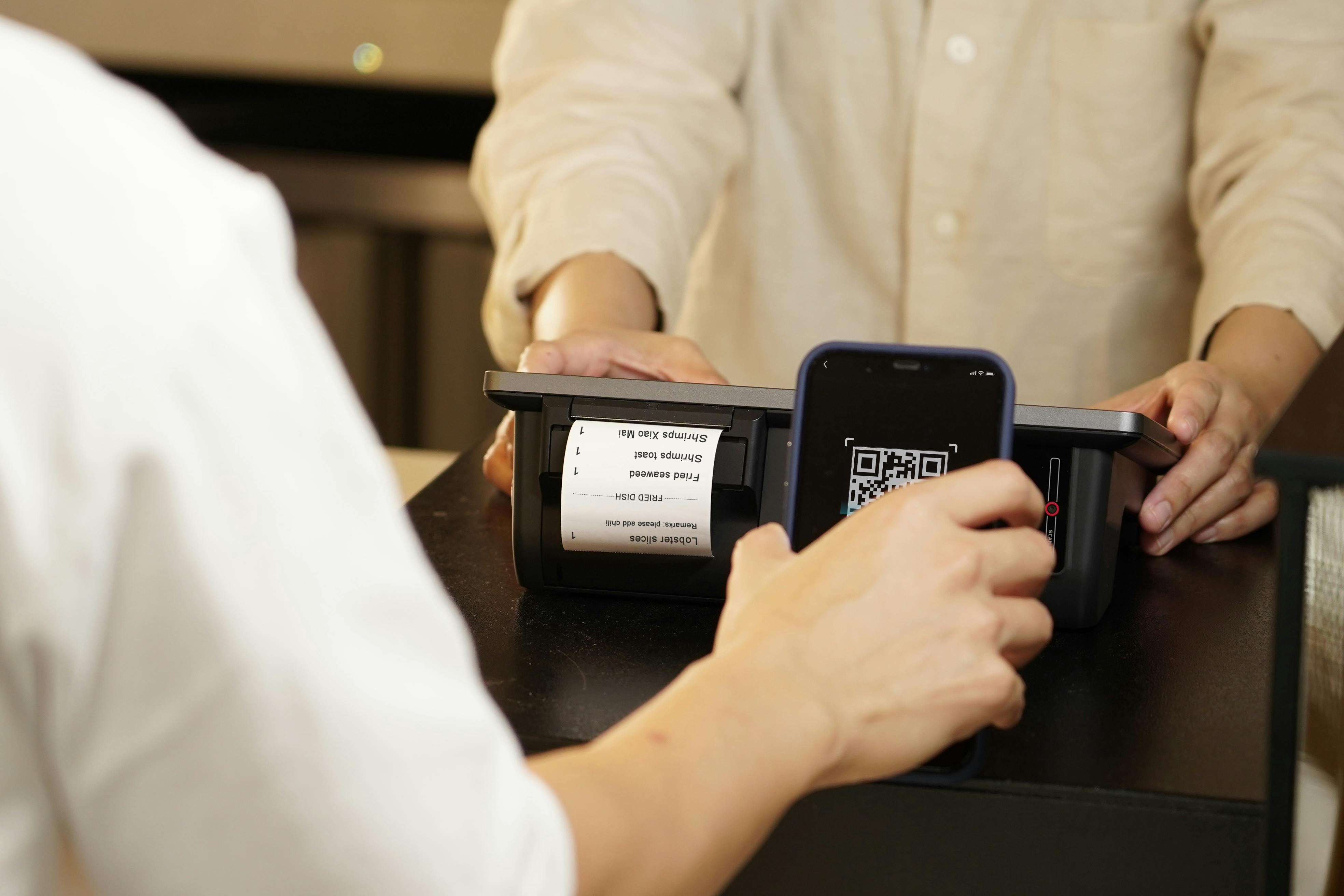 Image of someone scanning a QR code.