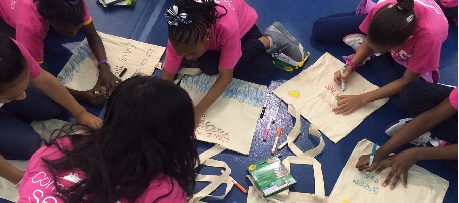 Students decorate reusable bags to promote sustainability