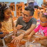 Young students with their teacher doing an activity