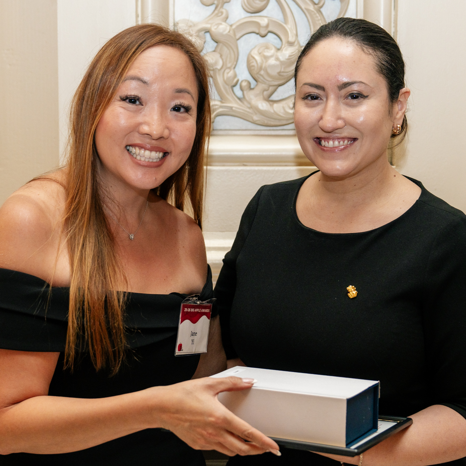 2025 Big Apple Award winner Jane Yi receives her awards from Chancellor Aviles-Ramos