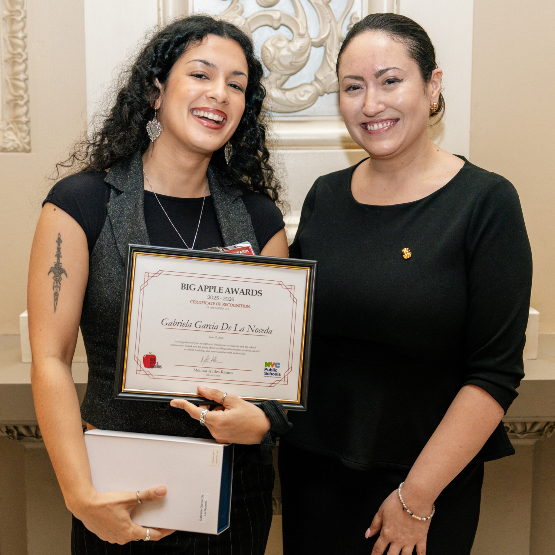 2025 Big Apple Award winner Gabriela Garcia De La Noceda receives her certificate from Chancellor Aviles-Ramos