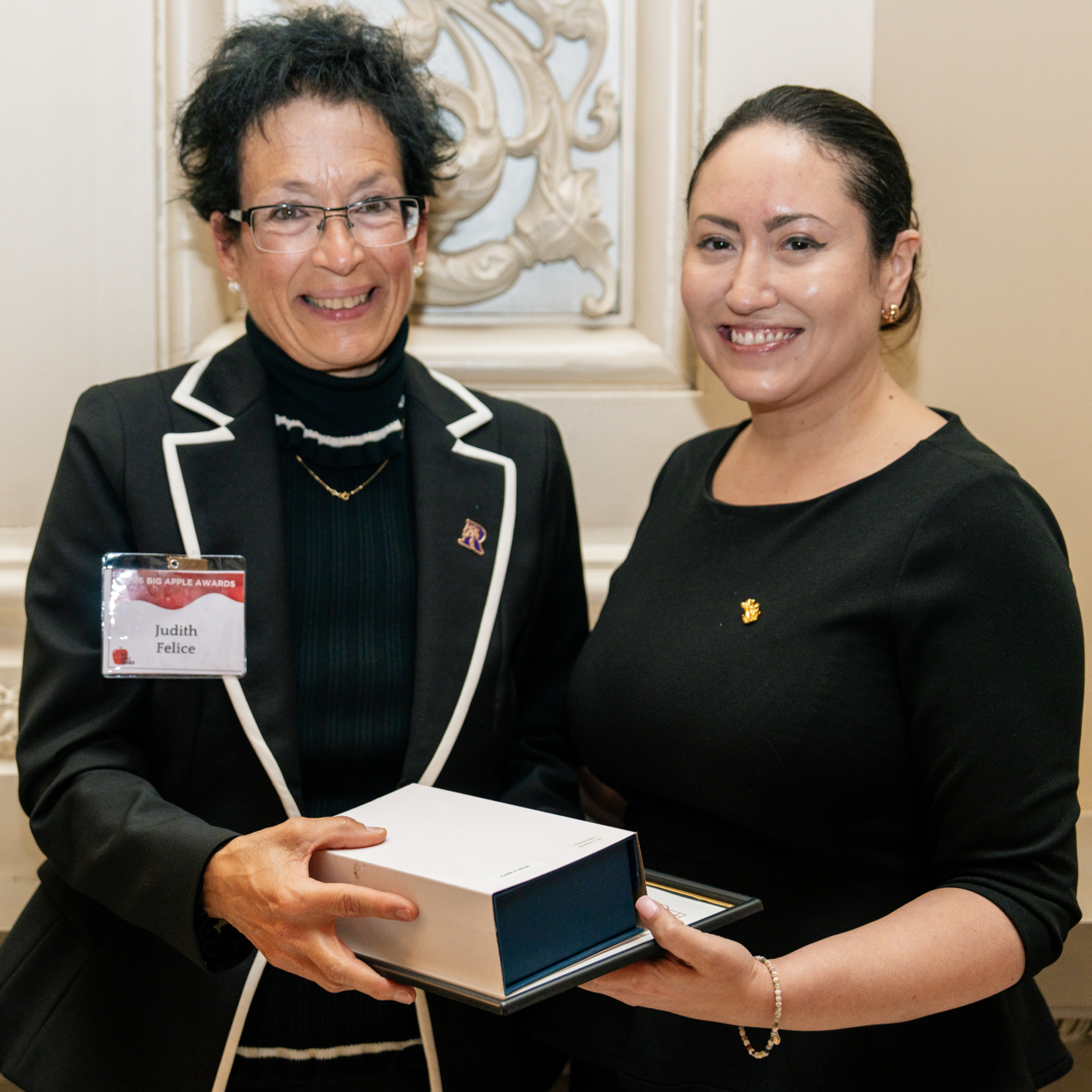 2025 Big Apple Award winner Judith Felice receives her awards from Chancellor Aviles-Ramos