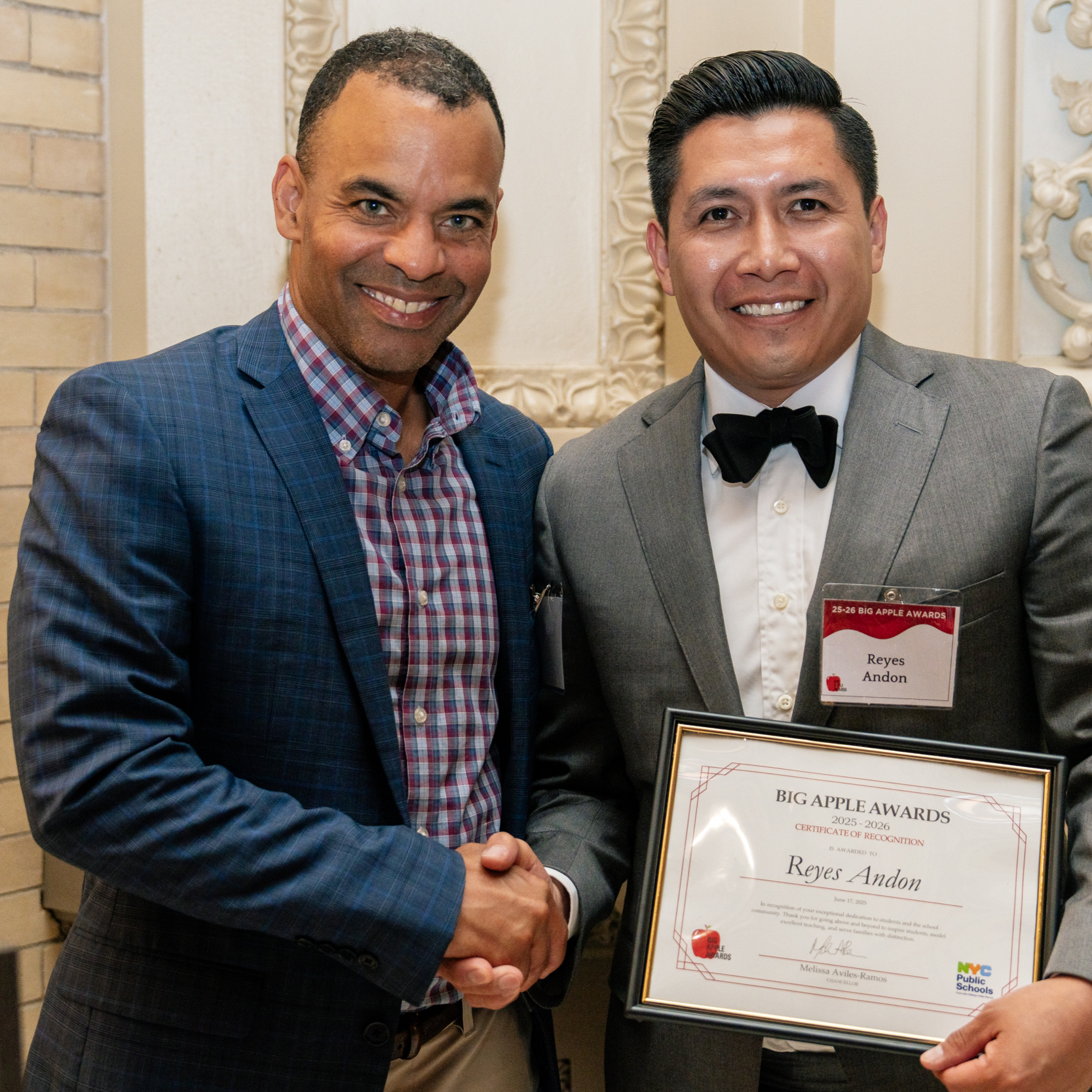 2025 Big Apple Award winner Reyes Andon receives his certificate