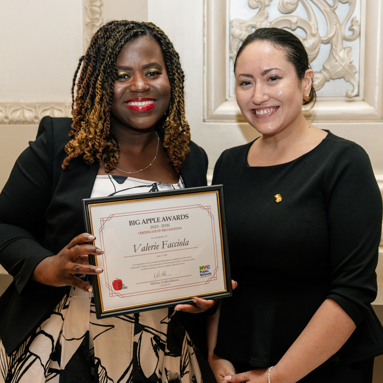 2025 Big Apple Award winner Valerie Facciola receives her certificate from Chancellor Aviles-Ramos