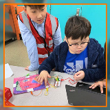 Two students working together on a computer science project