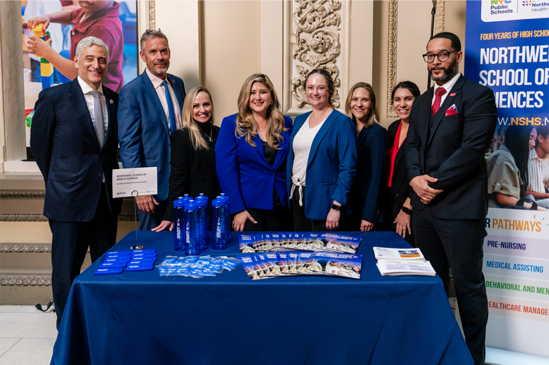 DC Weinberg (left), standing alongside representatives from Northwell Health and the Northwell School of Health Sciences