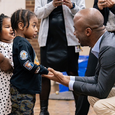 Chancellor Samuels meets with young students.