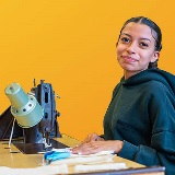 A student using a sewing machine