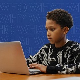 A student uses his laptop