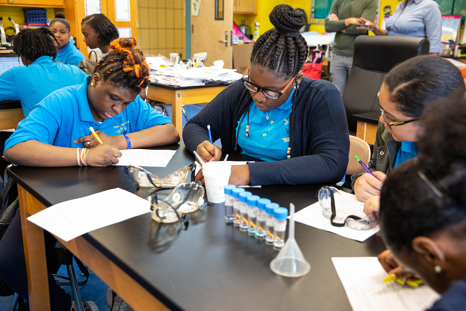 Students taking notes in science class