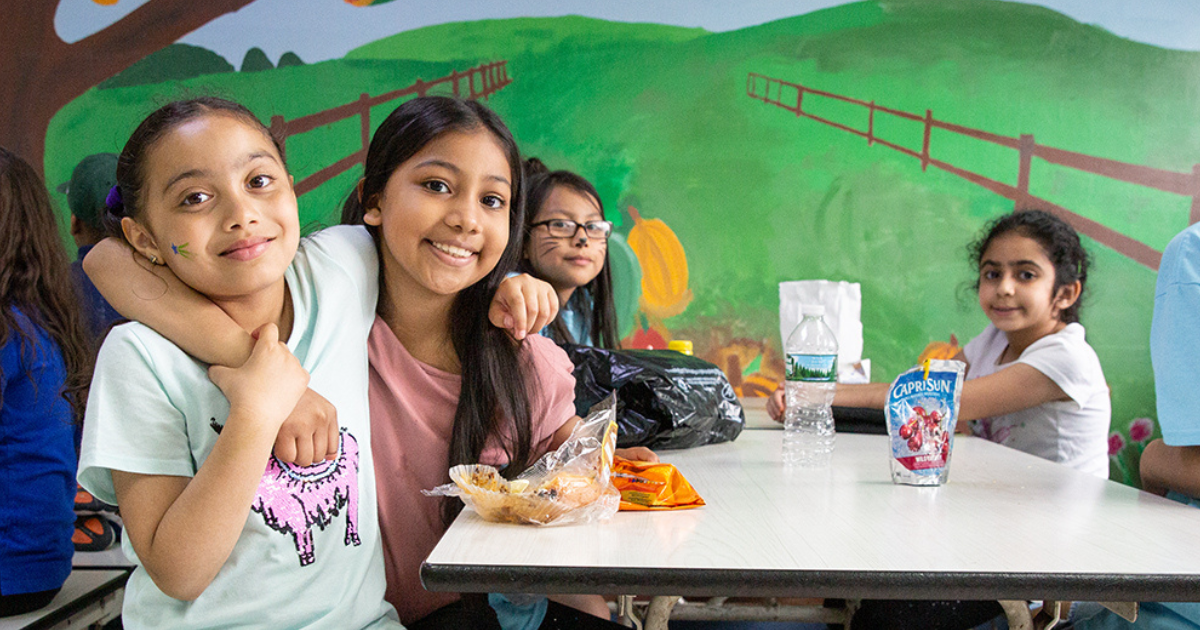 Students eating and hanging out in their cafeteria
