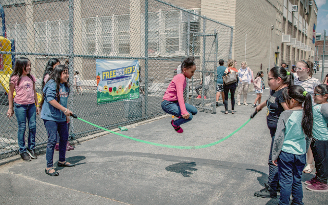 Students jump roping outside their school