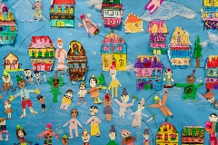 A classroom bulletin board that features student-made, snow-themed decorations.