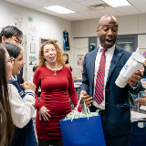 Chancellor Being Presented with Mug at CSI HS