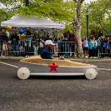 Chancellor Samuels riding in a soapbox car