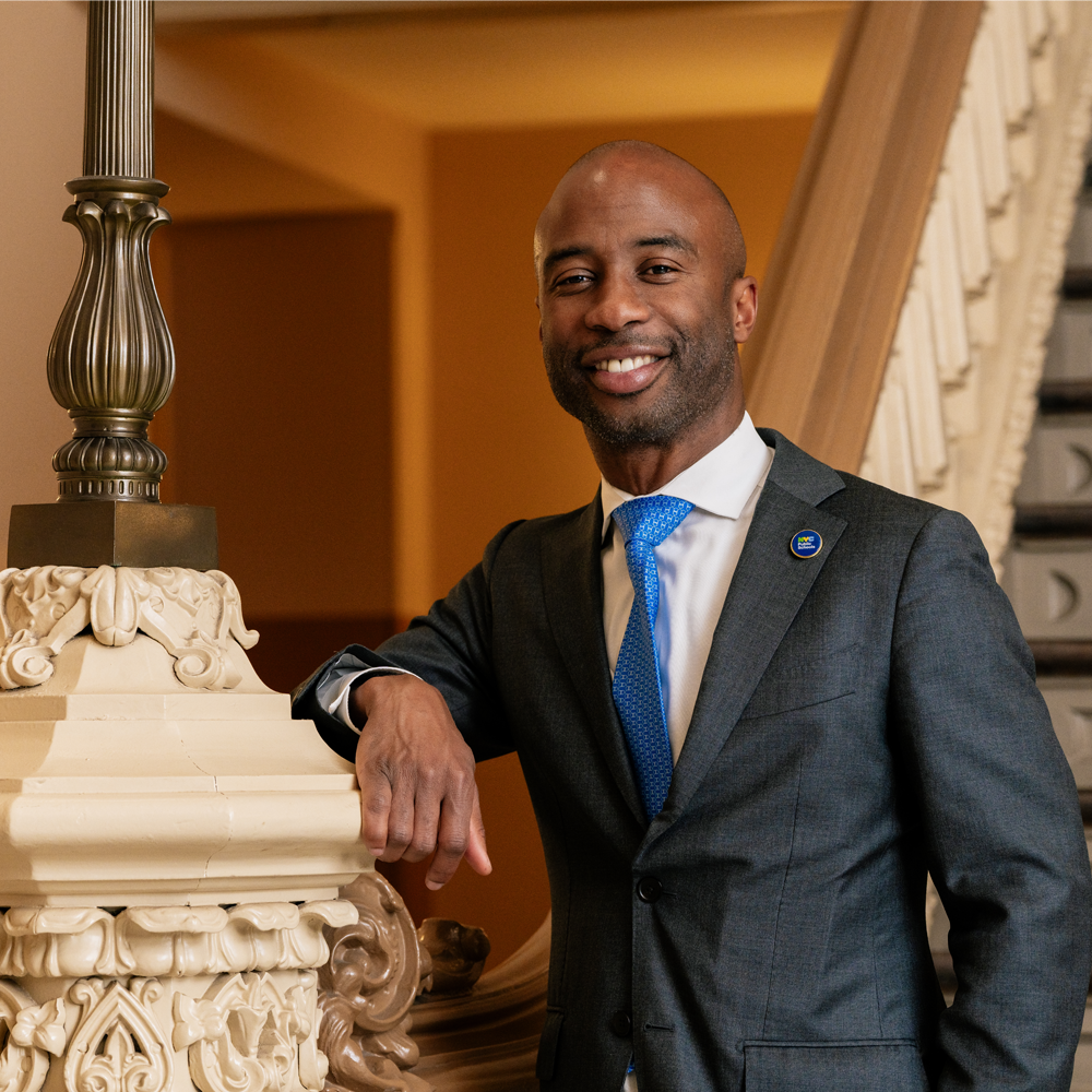 Chancellor Samuels Leaning On Banister