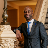 Chancellor Samuels Leaning On Banister