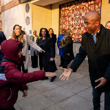 Chancellor Shaking Student's Hand at PS 194 Entrance