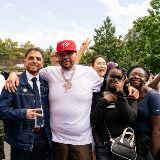 Principal Jason Reyes (left) of the new Bronx School of Hip Hop standing with Fat Joe (center), and two students (right of Fat Joe)
