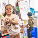 Mosaic PreK Student Smiling at Camera