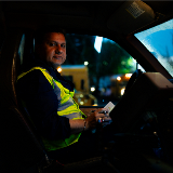 Side profile of a New York City school bus driver