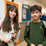 Two twelfth grade students, Dahlia Diez Chan (left), and Isaiah Tandjung (right) smiling at camera.