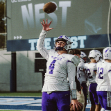 Tottenville Player Tossing Football in Air (Crop)