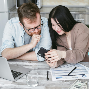 Two people looking at the phone