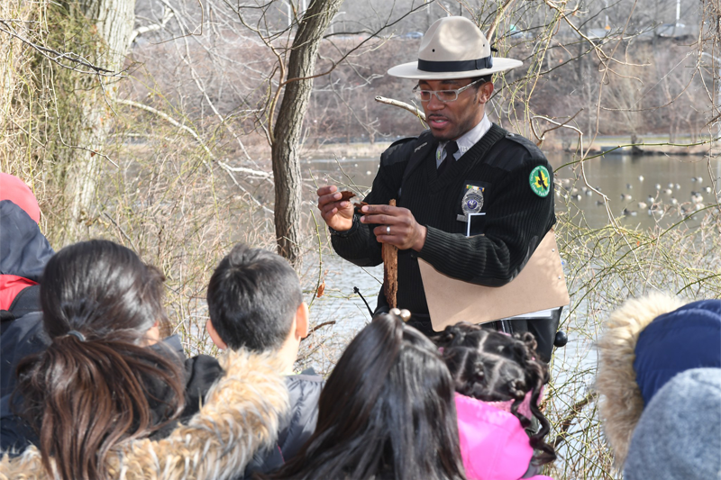 Urban Park Ranger giving young students a nature presentation.
